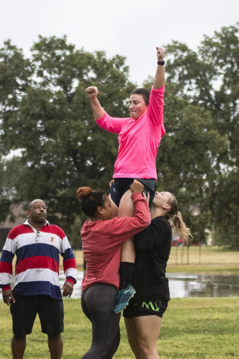 Wichita Valkyries teammates hoist Jenna DeRoo up for a catch during lineout drills on Sept. 11. Jumpers, like DeRoo, are teammates that can be lifted from below the waist to catch the ball when its thrown into play.