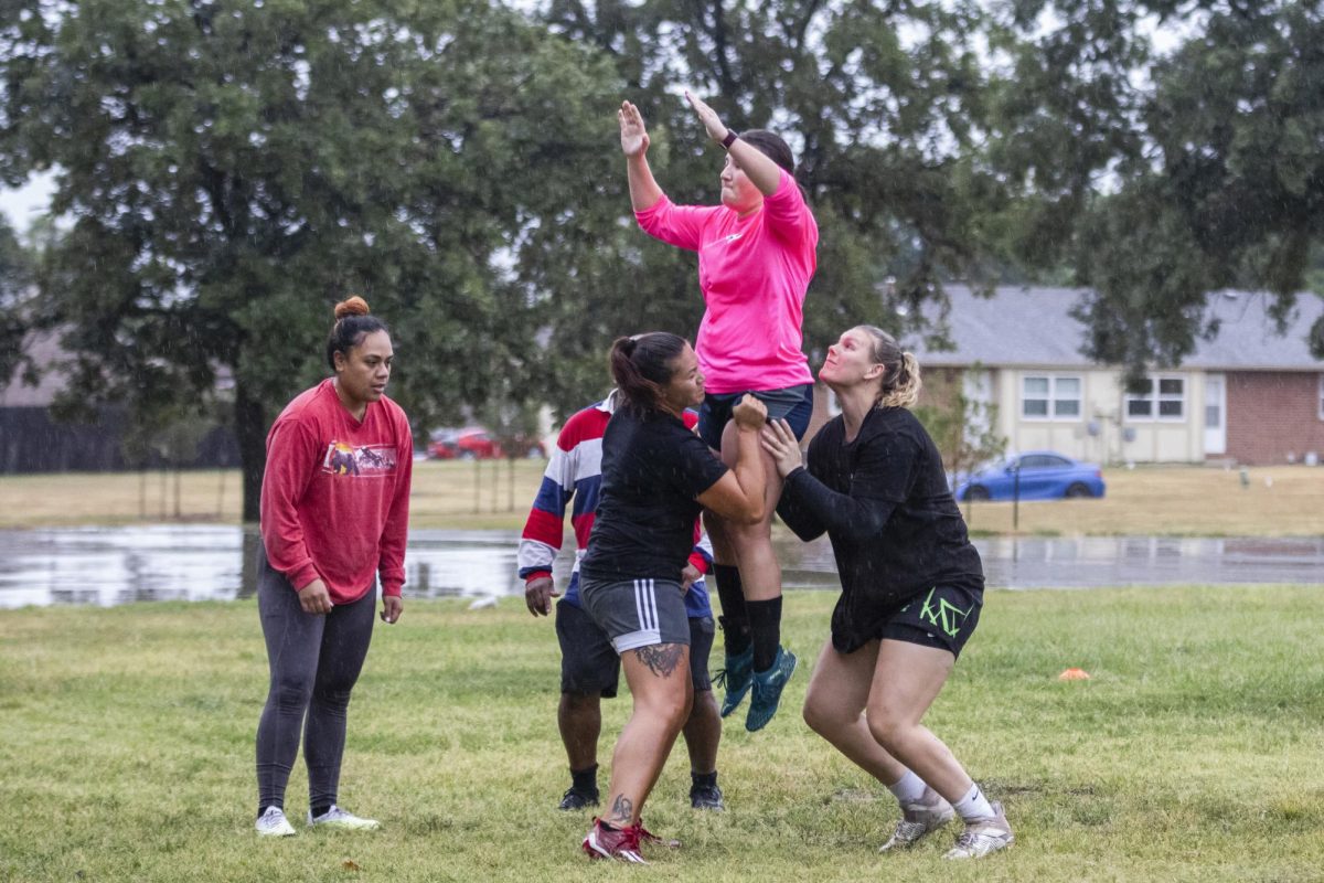 Wichita Valkyries teammates hoist Jenna DeRoo up for a catch during lineout drills on Sept. 11. Jumpers, like DeRoo, are teammates that can be lifted from below the waist to catch the ball when its thrown into play.