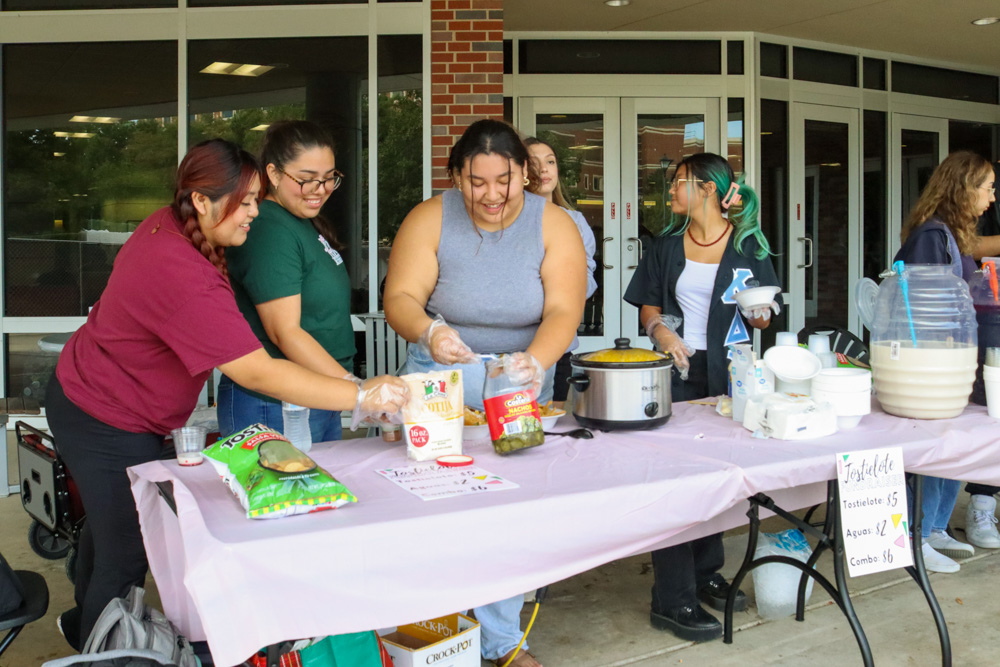 Mendoza, Gallegos and Rodriguez make tostielotos for the Kappa Delta Chi Sorority fundraiser on Sept. 21.