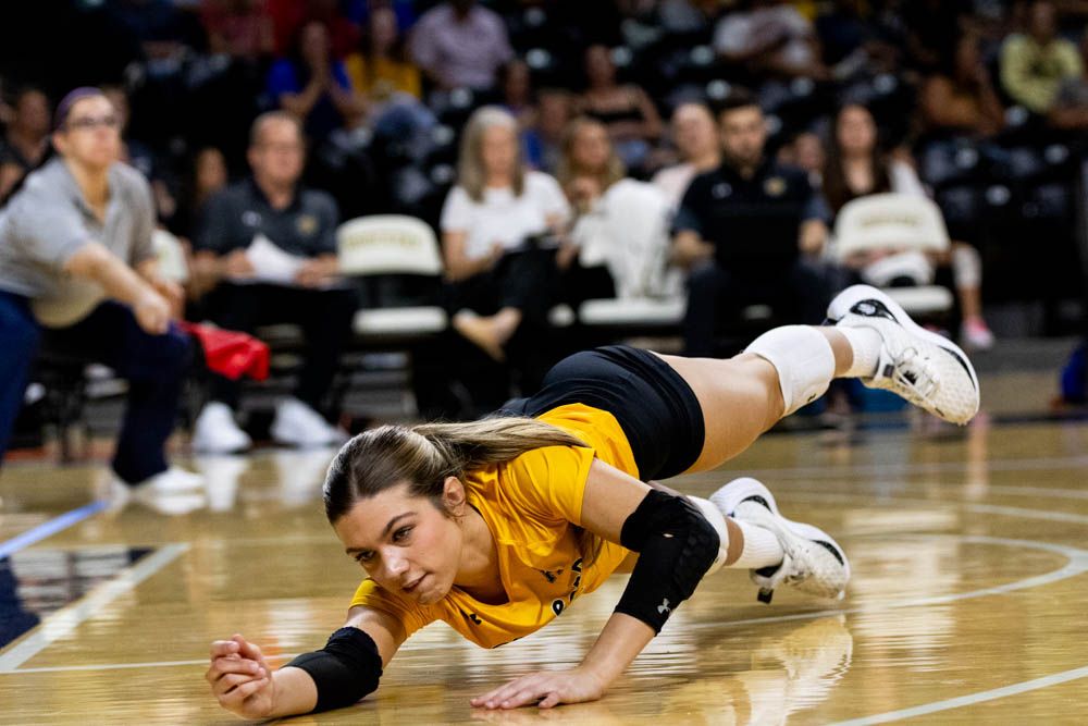 Libero and defense specialist Annalie Heliste dives for the ball in the second set during Sept. 7s game versus the Kansas Jayhawks at Charles Koch Arena. Heliste performed a grand total of 10 digs in the match lost to Kansas, 3-1 being the final score.