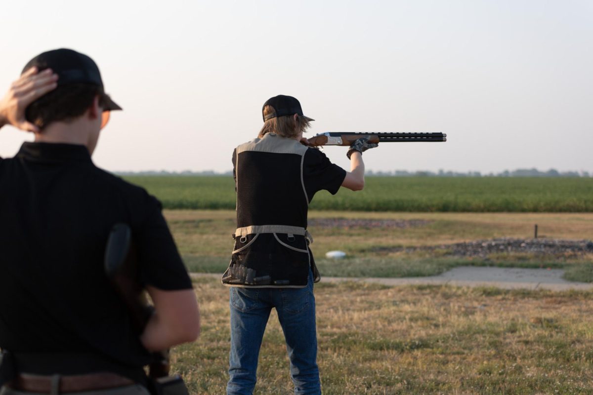 Hunter Orr levels the barrel of his gun to take down clay pigeons at practice on Sept. 6. The team hosts practice at Ark Valley Gun Club three times a week and competes about once a month in Kansas and surrounding states. 