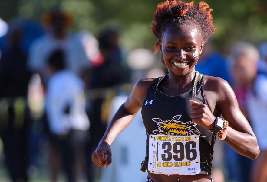 Lucy+Ndungu%2C+newcomer+and+one+of+Wichita+States+top+runners+comes+across+the+finish+line.+Ndungu+finished+in+first+place+in+the+JK+Classic+the+a+time+of+17%3A42.5+in+the+5k.+