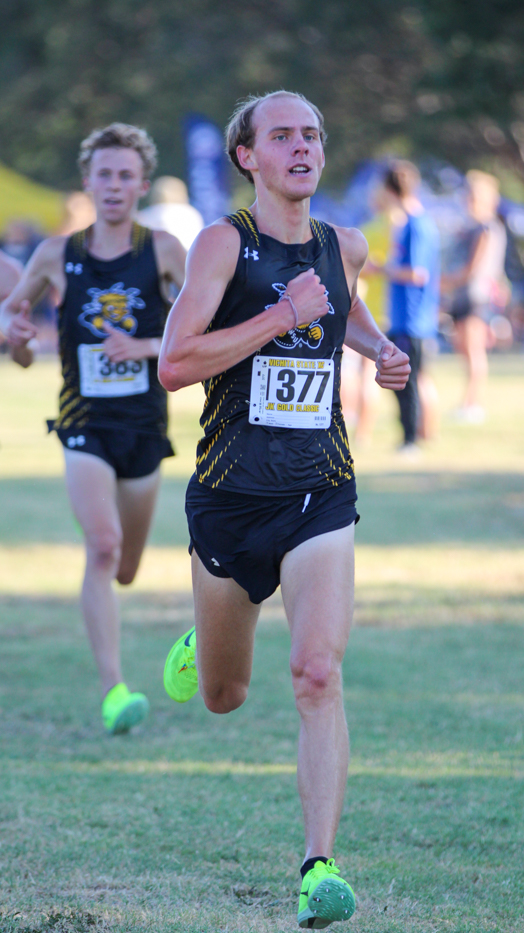 Jackson Caldwell trails behind Jackson Caldwell at the JK Gold Classic. Caldwell placed second with a time of 18:20.0 and Rios placed third with a time of 18:21.0 in the mens 6k.