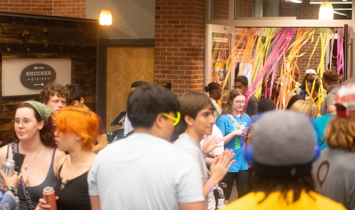 Students funnel through the doors of the dining hall to get free pancakes, french toast and biscuits and gravy. The Late Night Breakfast event, hosted in the dining hall of Shocker Hall, brought in flocks of students for the night life event on Sept. 7.