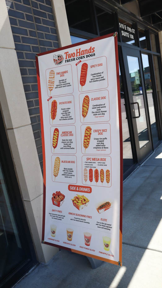 The menu at Two Hands Corn Dogs in Braeburn Square. Two Hands serves Korean-style corn dogs as well as other types of street food such as elote.