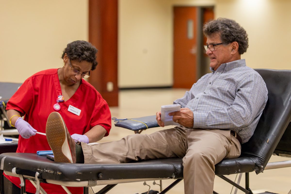 Dr. James Smith finishes his time at the Blood Drive event on Sept. 6. He was assisted by Jeanann Q., who is with the American Red Cross that hosted the drive. Dr. Smith is a cardiovascular doctor, when asked about the event he said, There is a critical need for blood, and I want to give back.