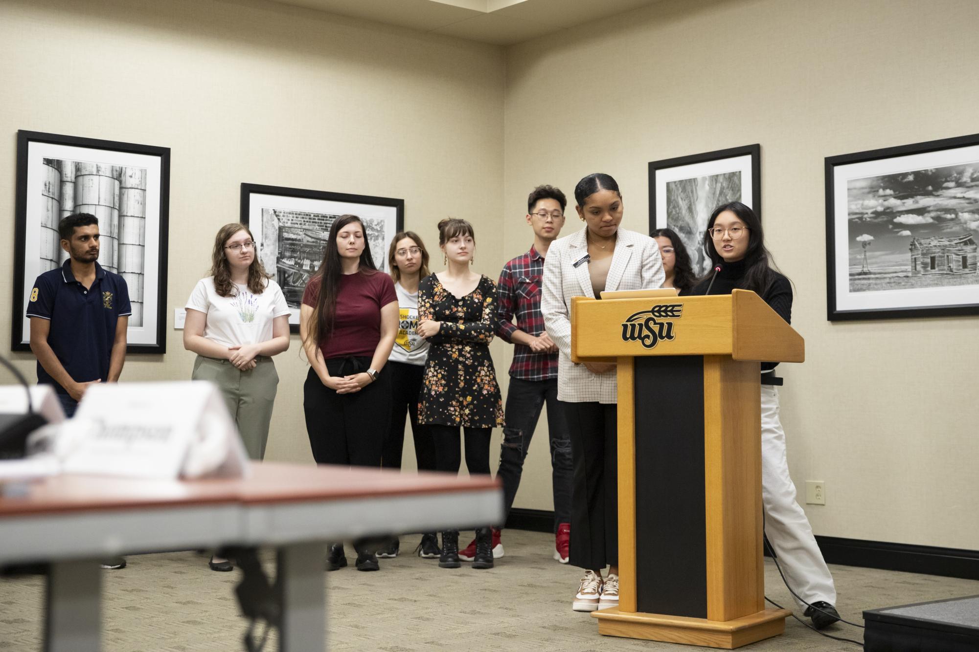Flanked by members of student organizations, Student Body President Iris Okere and Student Body Treasurer Jia Wen Wang speak to senators at the Sept. 12 meeting about an emergency funding act.
