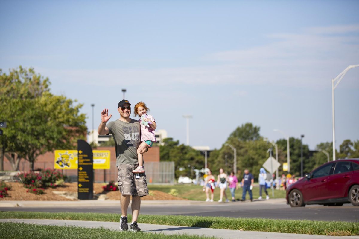 Kevin Morgan and his 3-year-old daughter walk during the one-mile memorial walk, which followed the Suspenders4Hope 5k on Sept. 30.