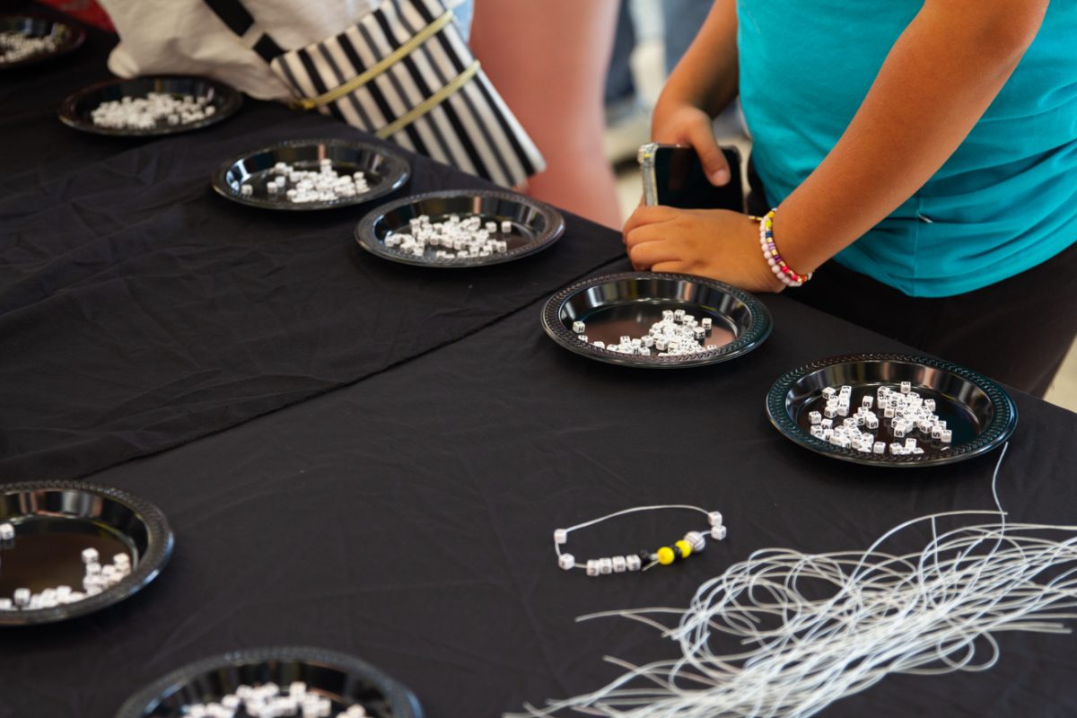 At the Taylor Swift tailgate on Sept. 9, tables were lined with different types of beads. The beads ranged from the WSU school colors to letters and charms related to the volleyball team.