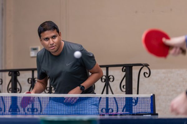 Mohamed Shafie, a WSU staff member in research engineering, plays in a match of table tennis.