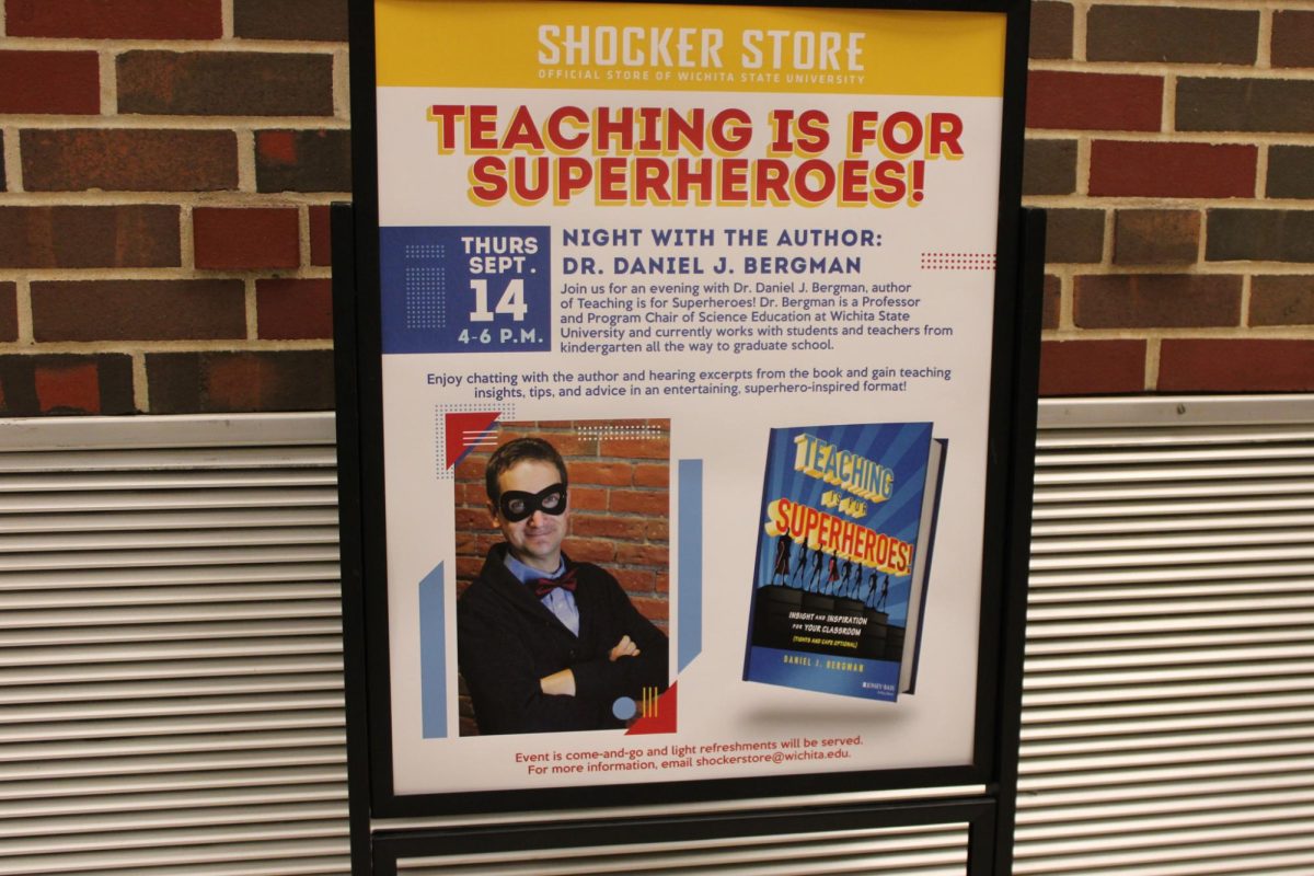 A sign directs guests to the Shocker Store Bookstore to attend professor Daniel Bergmans Night with the Author event on Sept. 14.