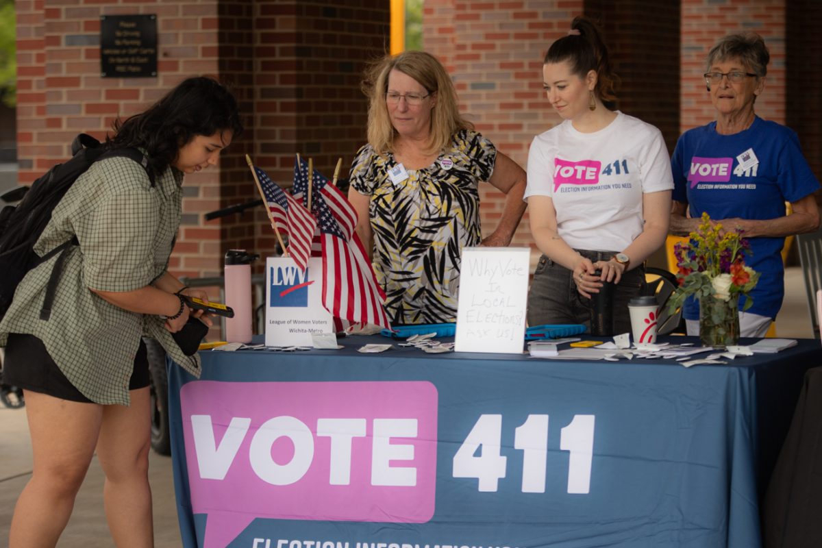 Sandy Wilson, Kayla Vix and Carole Neal from the League of Women Voters handed out QR codes with voter registration information on Sept. 19.