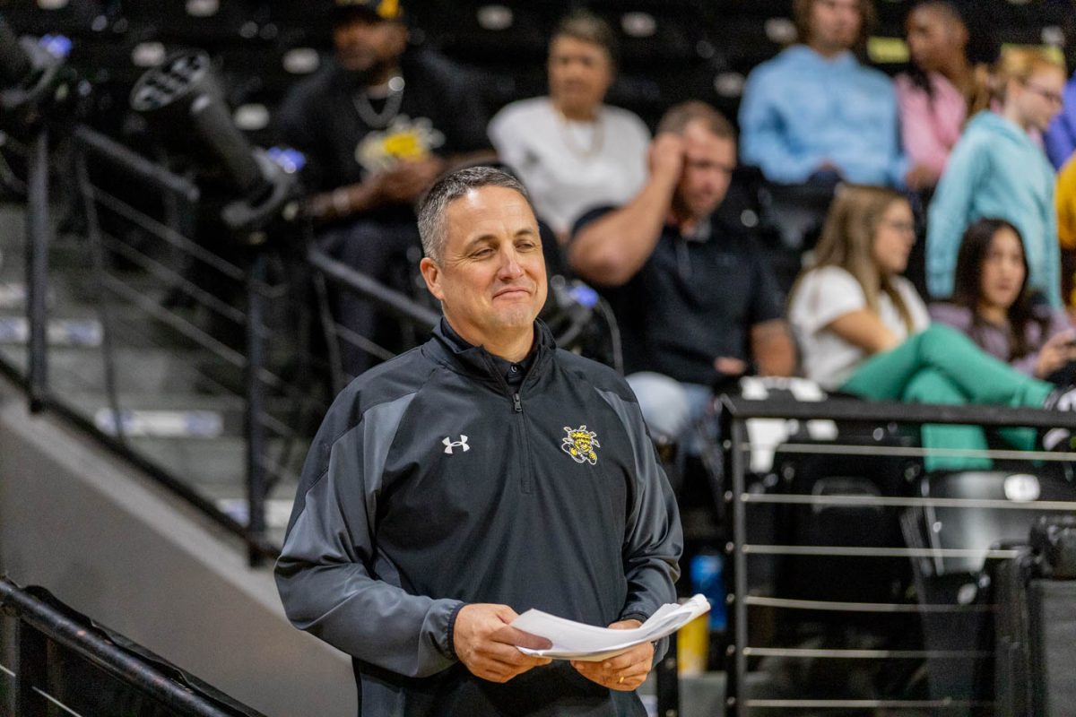 Director of Athletics Kevin Saal smirks after the completion of the basketball scrimmages at Shocker Madness on Oct. 7.