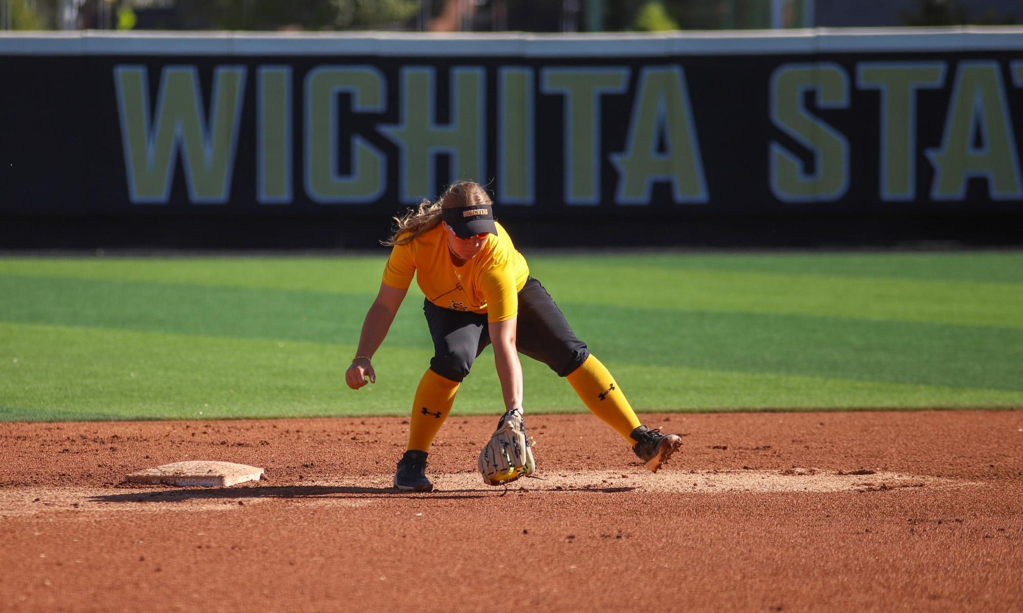 Sophomore infielder Siera Hoekstra gets a ground ball during warm-up before an exhibition game against South Dakota State on Oct. 8. 