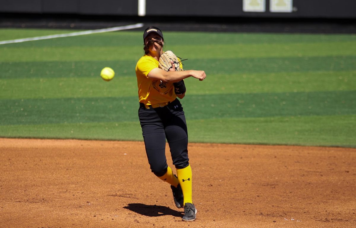 Sophomore infielder Sami Hood throws the ball to first base to get an out during the Oct. 8 game against South Dakota State.