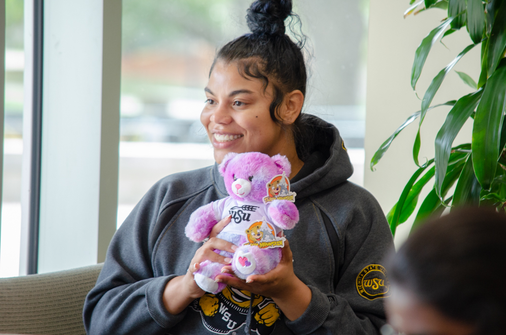 Lakyra Ivy poses with her new bear. On Oct. 3, WSUs Student Activities Council hosted a Build-A-Friend event, where students could build their own stuffed animal.