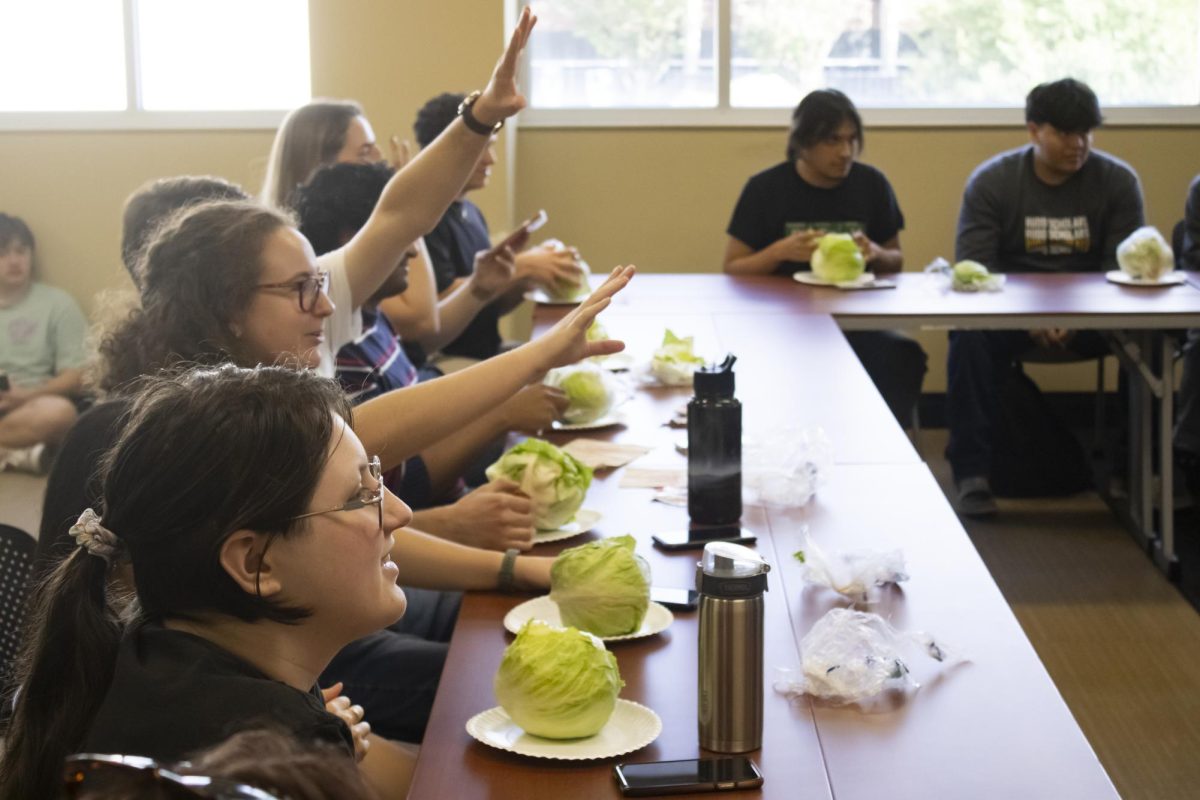 The contenders for the lettuce eating competition prepare to begin moments before the lettuce eating began. On Oct. 11, Wichita States Green Group invited students to participate in the second competition.   
