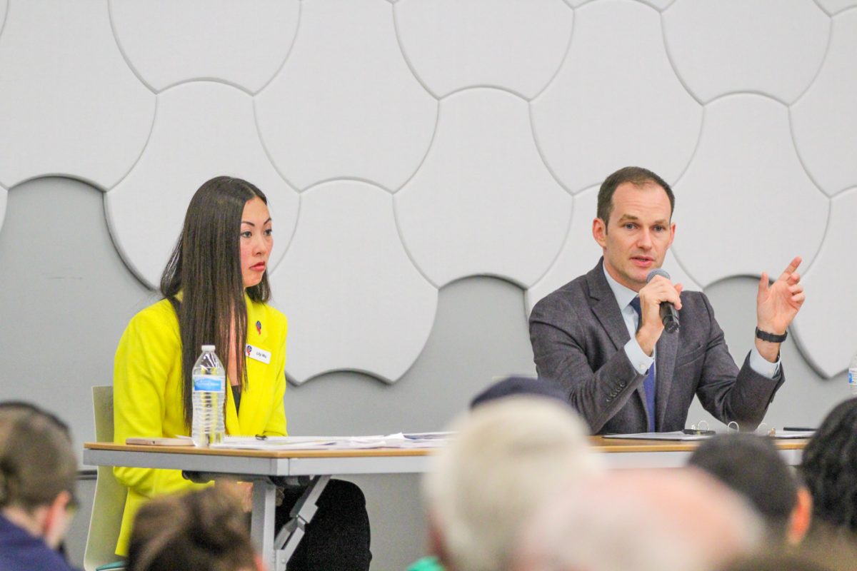 Mayoral candidate Lily Wu and current mayor Brandon Whipple speak at the mayoral candidate forum on affordable housing. Whipple shares his point of view first with his allotted time, and Wu shared her point of view after Whipple for the same amount of time.