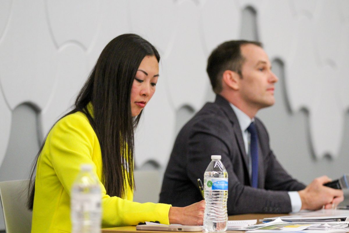 Candidate Lily Wu and current mayor Brandon Whipple speak at the Mayoral Candidate Forum on affordable housing. They both had the same alloted time to share their point of view.