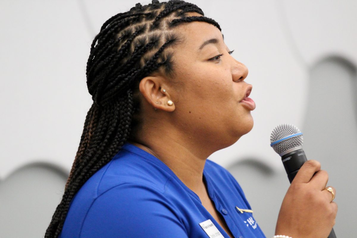 Danielle Johnson, executive director for Habitat for Humanity, opens up questions from the community for the mayoral candidates at the Mayoral Candidate Forum on Oct. 11. Habitat for Humanity and Wichita Journalism Collaborative hosted the event.