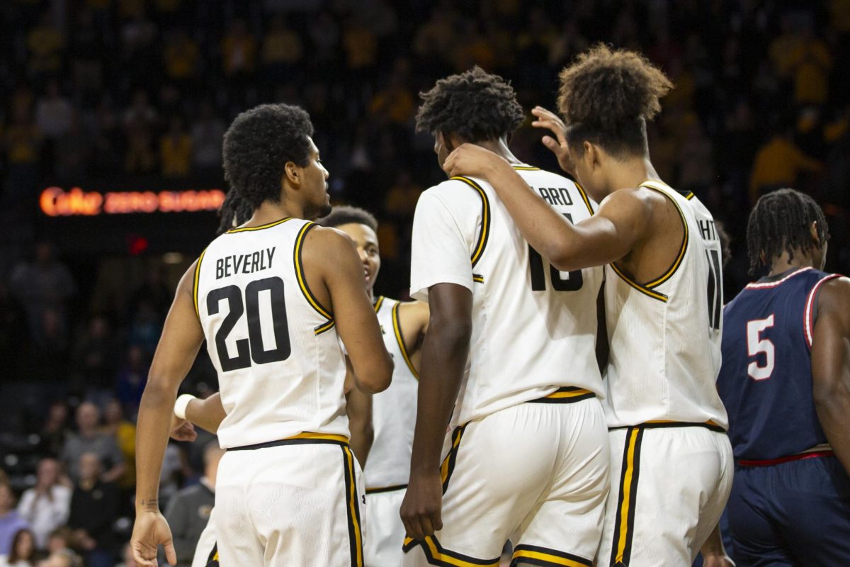 Mens+basketball+players+huddle+together+after+a+successful+play+by+Wichita+State+during+the+game+against+Rogers+State+on+Oct.+29.