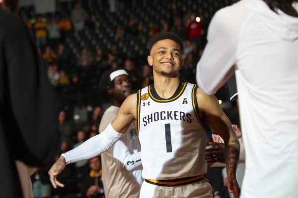 Junior guard Xavier Bell walks out onto the court after being announced for the Shockers starting lineup. Bell helped lead the team to a win against Rogers State, grabbing 13 points on Oct. 29. 