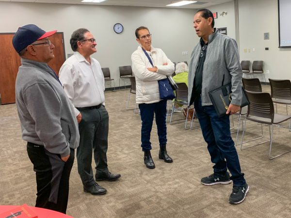 Guest speaker and historian David Rodriguez (far right) discusses the film with community members at the screening. Mexican Americans Hit Home Runs in Kansas premiered at the Evergreen branch library on Sat. 