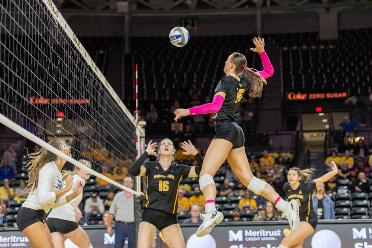 Morgan Stout leaps for the kill during the first set in the match against Tulsa. Stout made six kills and five blocks during the Oct. 20 match.