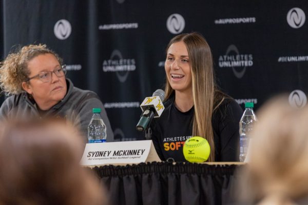 Sydney McKinney, a WSU softball alum, speaks as a panelist during the Nov. 17 press conference in the Heskett Center.