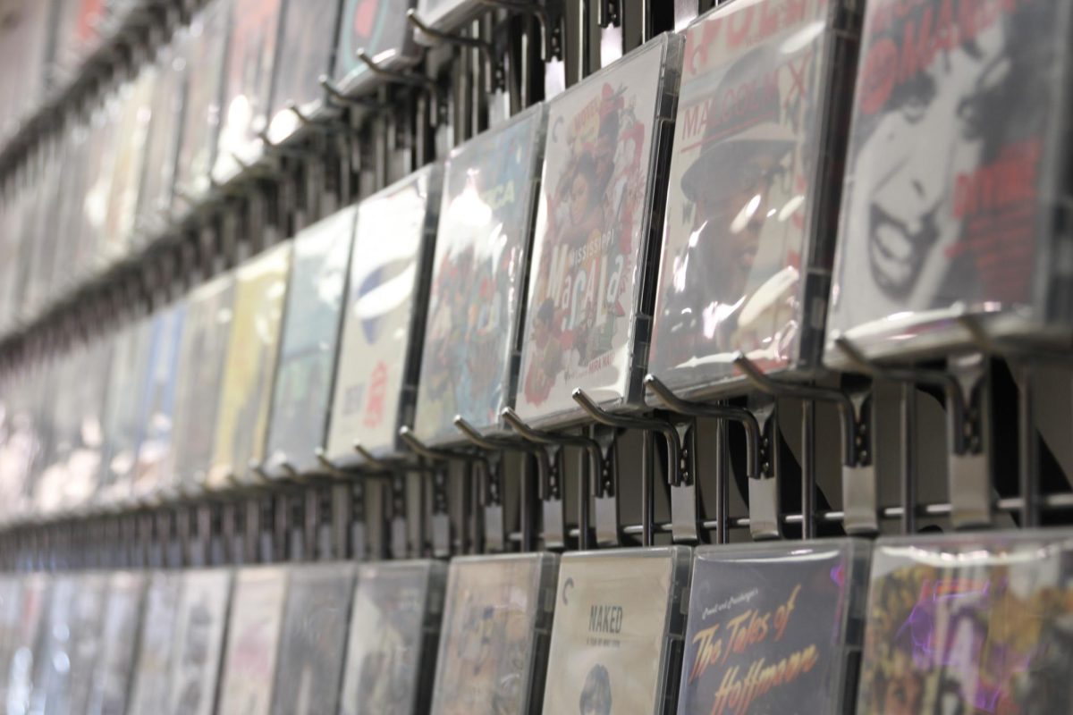 A display of Criterion Collection films available for renting are located at CINE-GENIC. CINE-GENIC, a video rental store, opened in August 2023 and is located at the back of Vortex Souvenir.