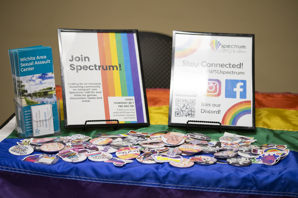 Stickers, pronoun buttons and rainbow pins on the Spectrum: LGBTQ & Allies information table were available for attendees.