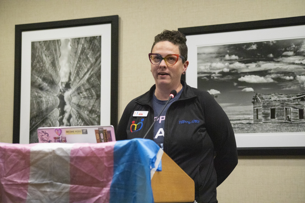 On behalf of M-Care Healthcare, Tiffany Moos shares a view words regarding her organizations services and commitment to providing healthcare to LGBTQ+ individuals. Moos, a nurse practitioner, said M-Care equipped her with the resources to care for the LGBTQ+ people in her life.