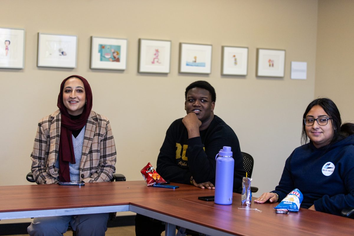 Senior Emaan Syed, junior AJ Haynes, and first-year student Lesly Hernandez, play on the same team for Tradition Jeopardy on Nov. 1. Their team ended up winning the game.