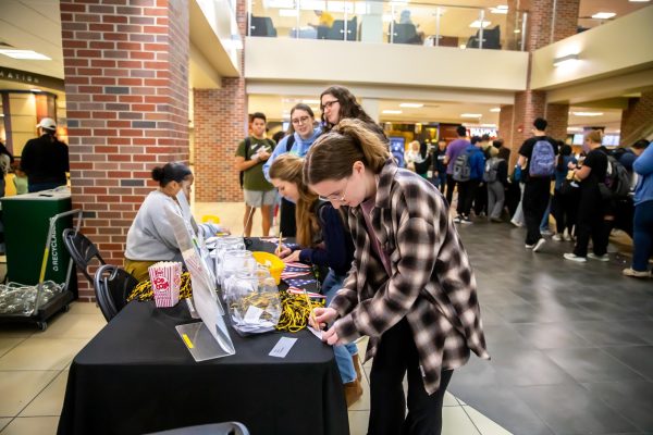A student participates in the Shockers Vote! Coalition Election Bash on Nov. 7.