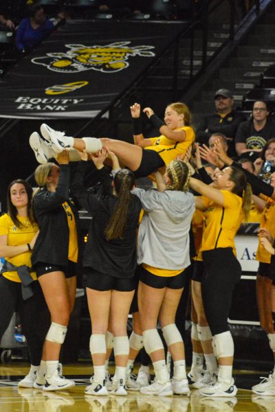 The volleyball team celebrates a winning set at the game against the University of Texas at San Antonio on Nov. 11.