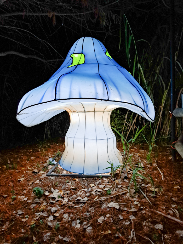 A mushroom sits in the trees at the Sedgwick County Zoo for the Wild Lights show on Nov. 11. Mushrooms are displayed throughout the zoo along the path to go along with the Alice in Wonderland theme.