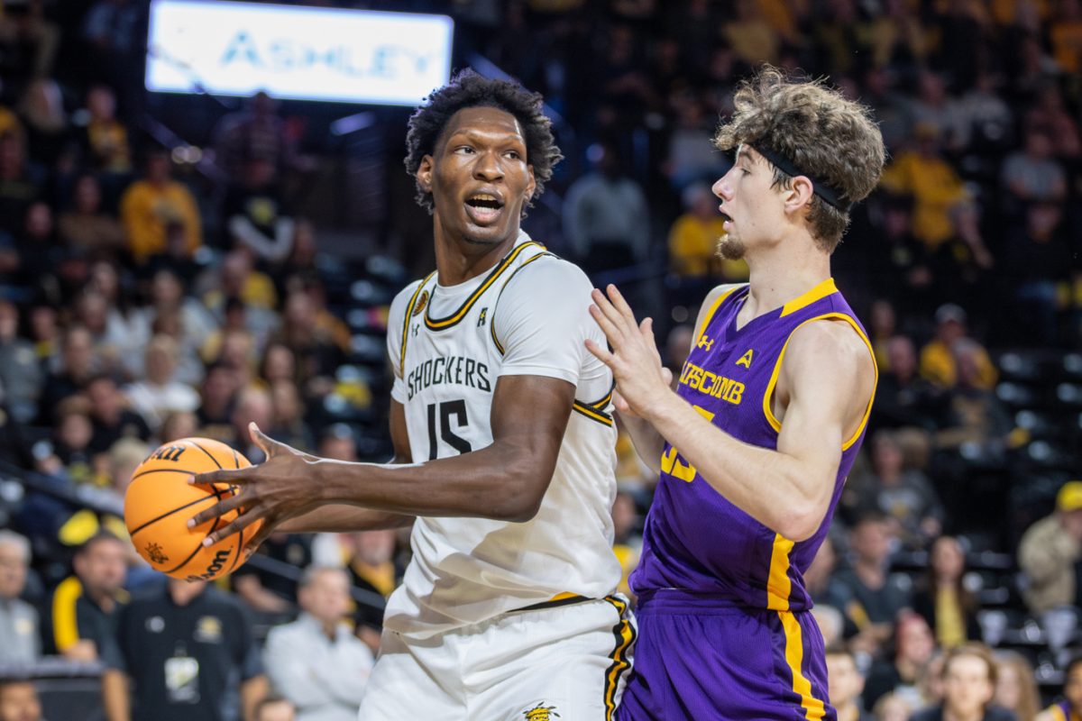 Quincy Ballard prepares to pass the ball to a teammate during the Nov. 6 game versus Lipscomb. Ballard scored 10 points throughout the Monday night game in Charles Koch Arena.
