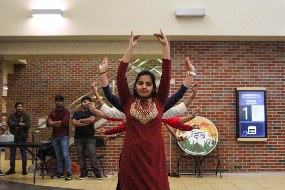Led by Heena Begum Mohammad, dancers in the Indian Student Associations Flashmob event create a line formation to do traditional dance choreography. The flashmob was intended to be a promotional activity for another one of the organizations events.