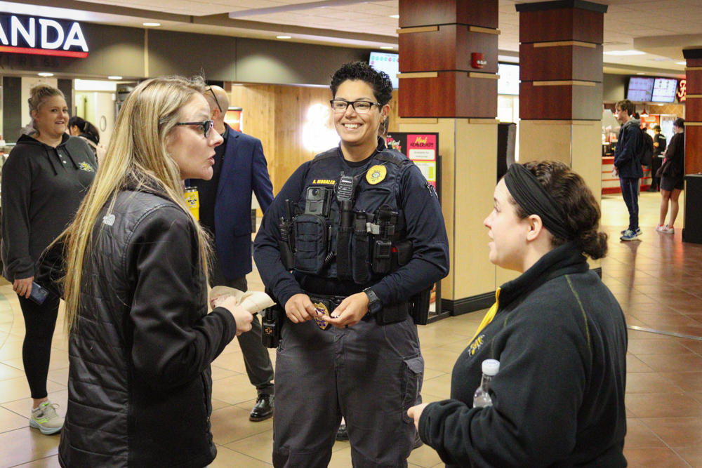 Sergeant Alba Morales talks to two individuals at an event that aimed to bring WSU community members to talk to officers over donuts on Nov. 8.