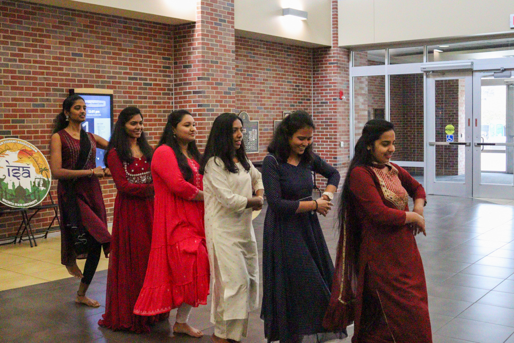 Dancers in the Indian Student Associations Flashmob event create a line formation to do traditional dance choreography. The flashmob was intended to be a promotional activity for another one of the organizations events.
