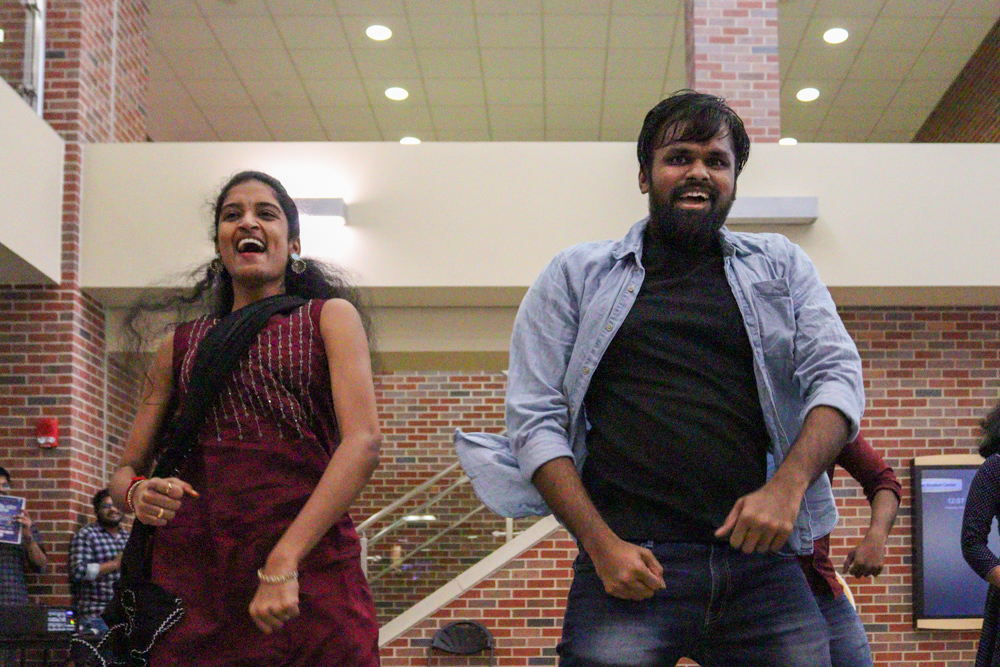 Sudhireddy Tiwari Chowdary and Sethu Madhav Nallana dance together at the Indian Student Associations flashmob event on Nov. 8.