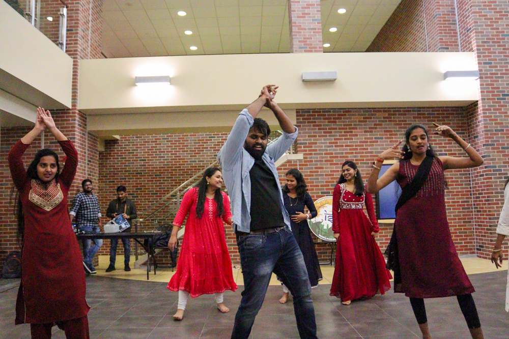 Sethu Madhav Nallana dances with other members of the Indian Student Association flashmob event on Nov. 8.