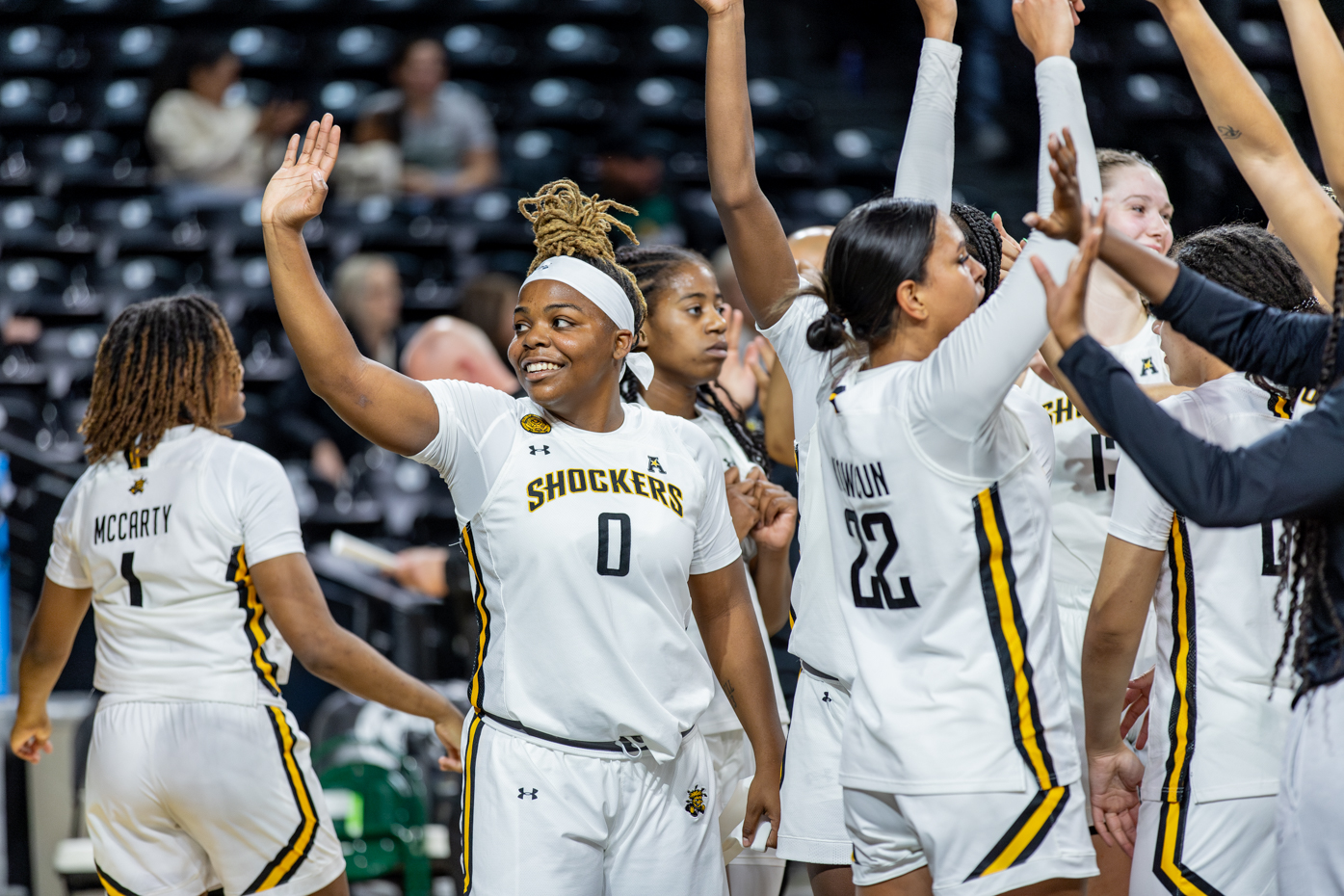 Following the Shocker win against the MSSU Lions, Aniya Bell waves to the audience. Wichita won their Nov. 1 exhibition match, 75-65.