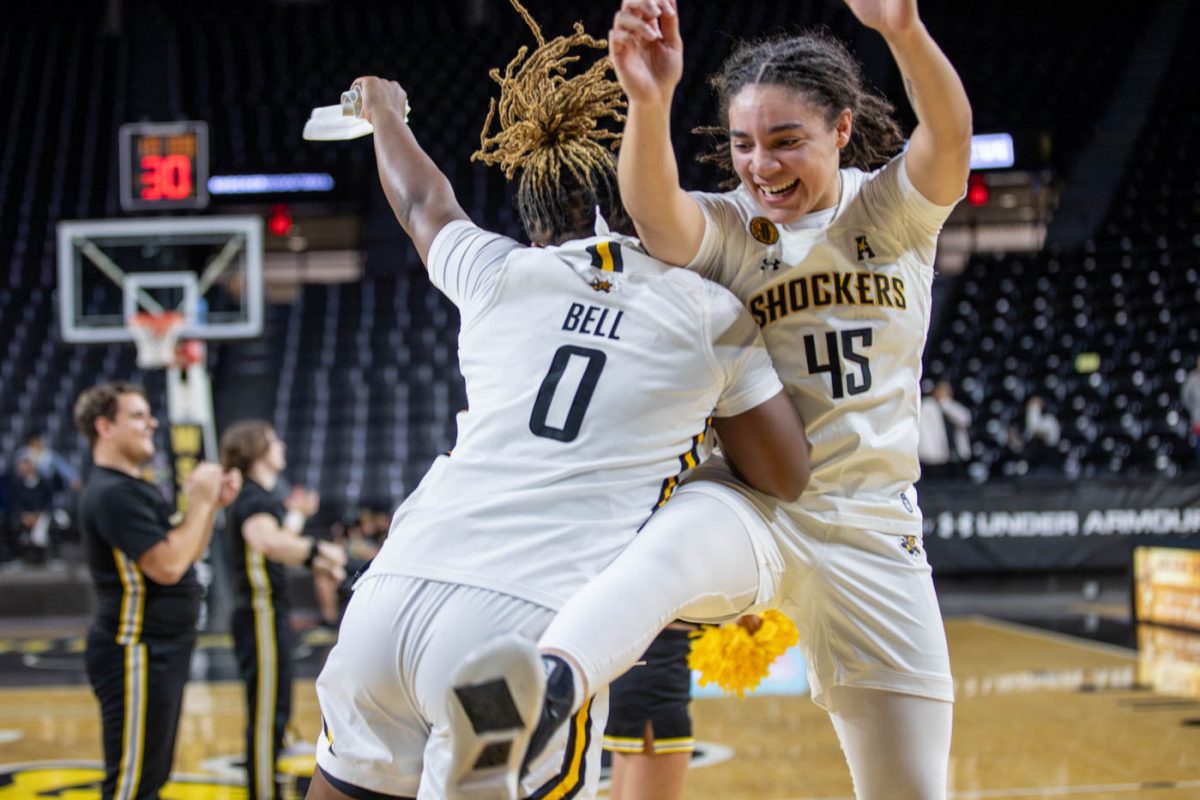 Following+the+teams+win%2C+Aniya+Bell+and+Jeniah+Thompson+celebrate+with+a+side+jump.+The+Shockers+defeated+Saint+Louis+78-59.