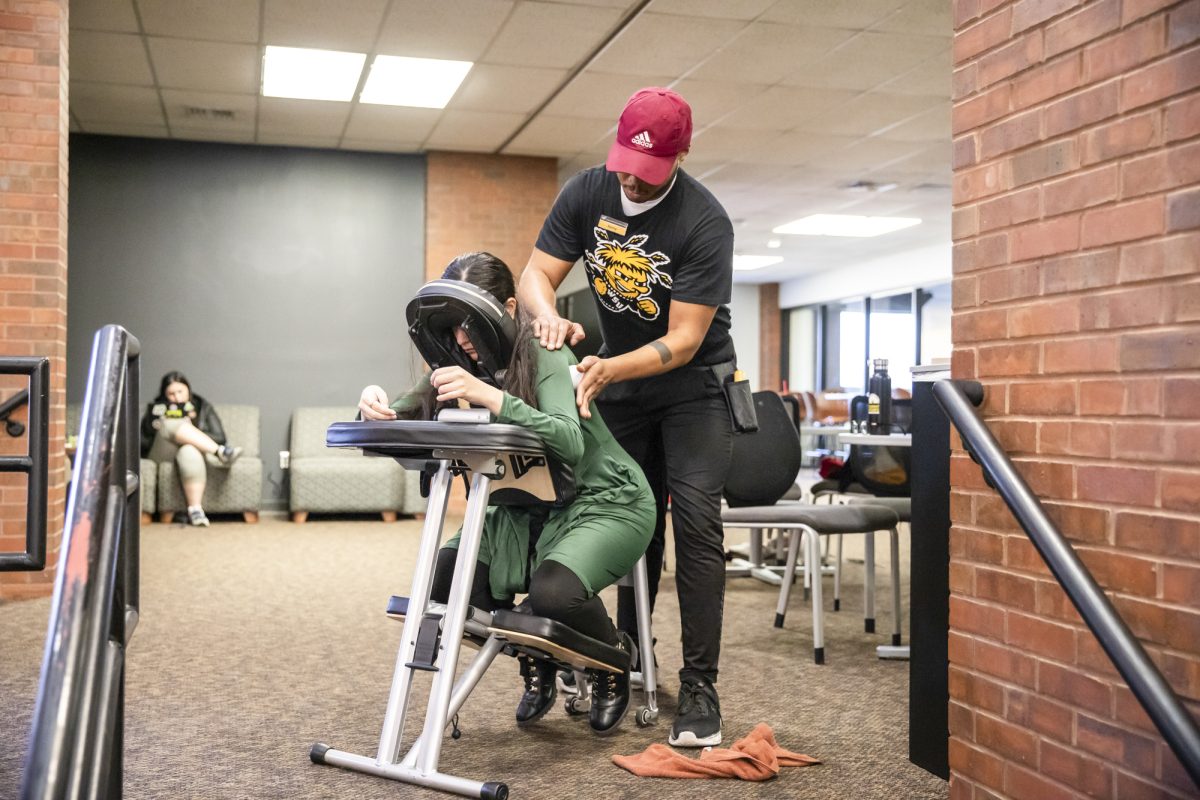 Freshman Caitlyn Soto-De La Cerda receives a chair massage at the Heskett Center on Dec. 5.