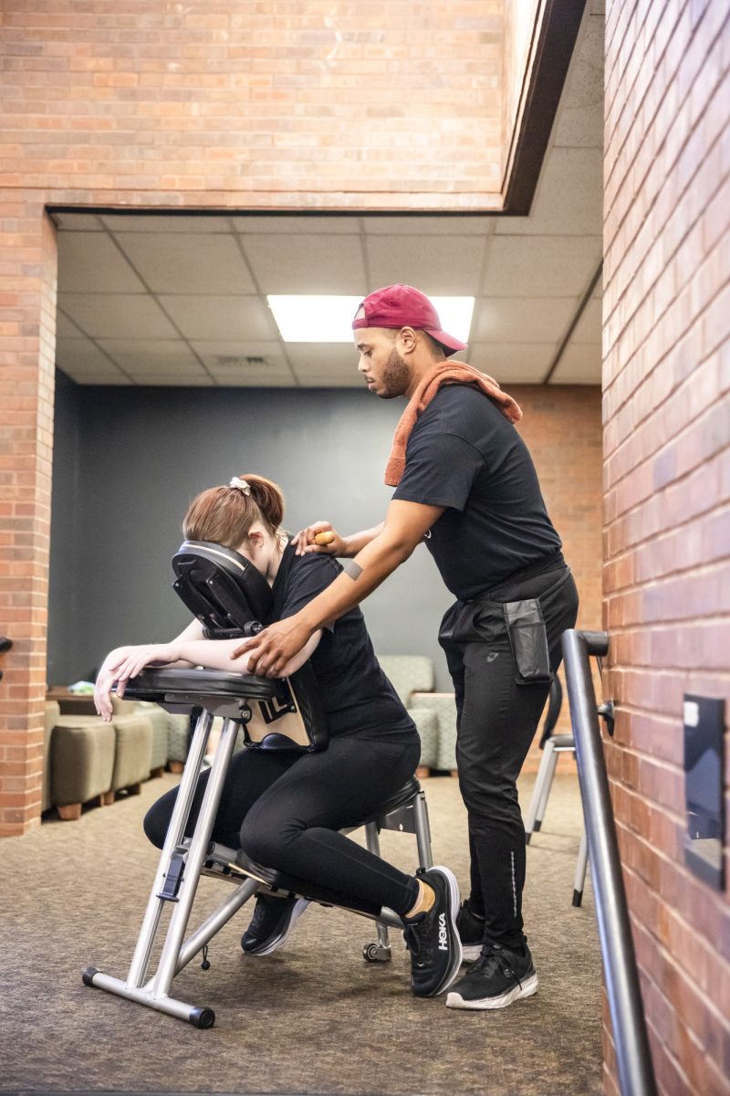 Sophomore Ainsley Altenbern receives a chair massage at the Heskett Center on Dec. 5.