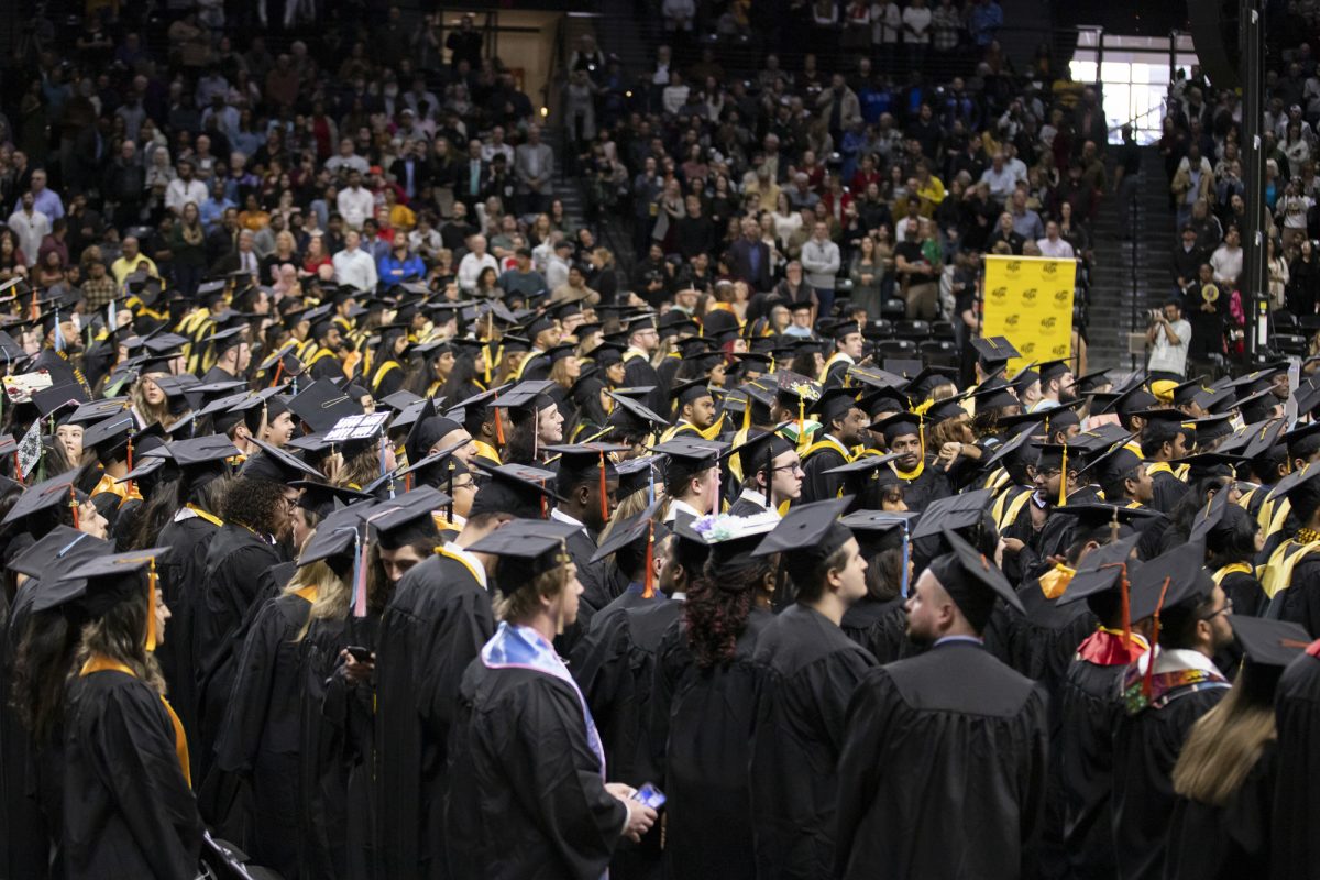 Fall 2023 graduates gather in Charles Koch Arena for the 126th Commencement at Wichita State University on Dec. 17, 2023.