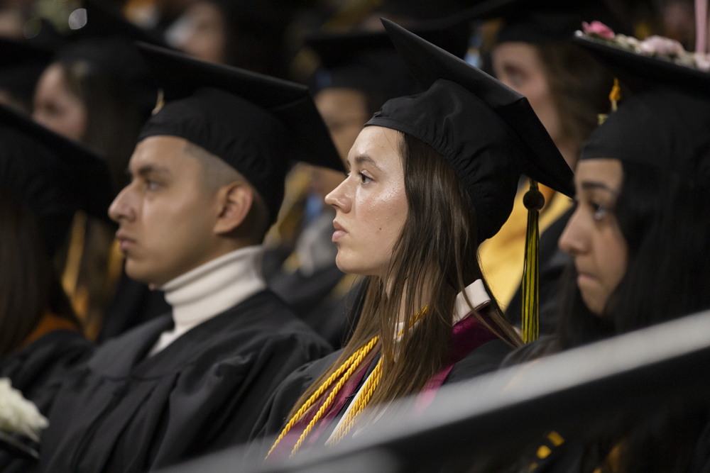 Jaycie Nelson, a fall 2023 graduate, looks into Charles Koch Arena during the Fall 2023 Commencement ceremony on Dec. 17. Nelson graduated magna cum laude with a Bachelor of Arts in English.