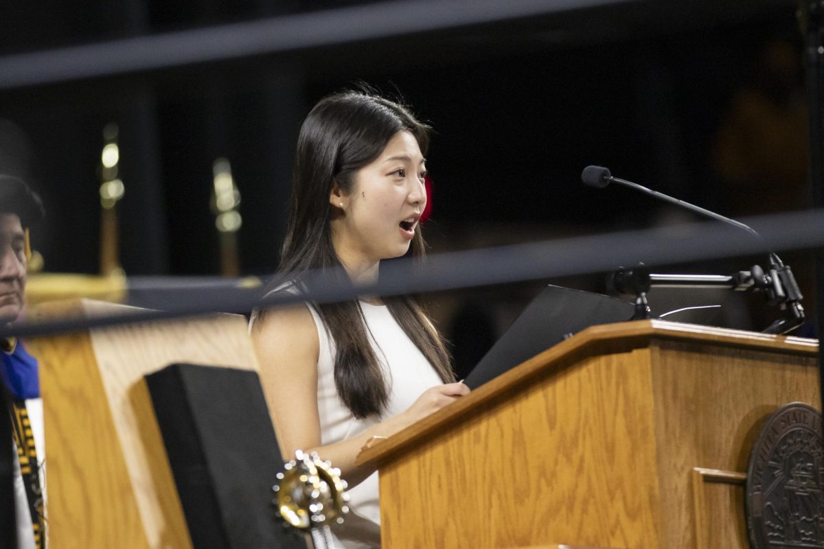 Pulip Han, a music opera performance graduate student, sings the Wichita State Alma Mater with fall 2023 graduates on Dec. 17.