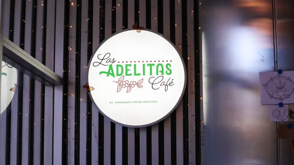 Lit up sign inside Las Adelitas Café on the first floor of The Lux Apartment building located in downtown Wichita.